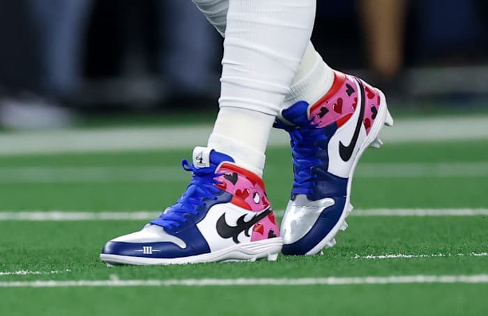 View of blue and pink Air Jordan cleats.
